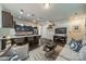 Open living area with hardwood floors, combined kitchen, comfortable seating, and modern decor at 947 Warren Burgess Ln, Charlotte, NC 28205