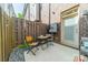 Cozy patio with fenced in area, seating, and string lights at 947 Warren Burgess Ln, Charlotte, NC 28205