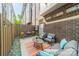 Private patio with both dining and lounge seating, string lights, and fenced perimeter at 947 Warren Burgess Ln, Charlotte, NC 28205
