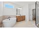 Bright bathroom featuring modern fixtures, a soaking tub, and a separate tiled shower at 1065 Kinship Dr # 080, Lancaster, SC 29720