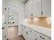 Butler's Pantry features countertop, cabinets, lighting, and designer tile backsplash at 1065 Kinship Dr # 080, Lancaster, SC 29720