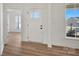 Bright foyer featuring hardwood floors, white trim, and natural light streaming through the sidelight windows at 1065 Kinship Dr # 080, Lancaster, SC 29720