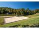 Community sand volleyball court with lake view at 128 Inlet Point Dr, Tega Cay, SC 29708