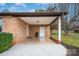 Covered patio with brick flooring and storage area at 130 Island Park Ln, Statesville, NC 28625