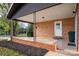 Brick covered patio with a white door and black metal railings at 130 Island Park Ln, Statesville, NC 28625