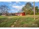 Red house exterior with walkway and grassy yard at 130 Island Park Ln, Statesville, NC 28625