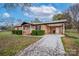 Brick ranch house with covered porch and landscaped yard at 130 Island Park Ln, Statesville, NC 28625