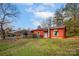 Red house exterior with front yard and carport at 130 Island Park Ln, Statesville, NC 28625