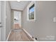 Laundry room with vinyl flooring and view into kitchen at 130 Island Park Ln, Statesville, NC 28625