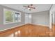 Hardwood floors and ceiling fan in this bright living room at 130 Island Park Ln, Statesville, NC 28625