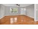Hardwood floors and neutral walls in this spacious living room at 130 Island Park Ln, Statesville, NC 28625