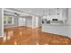 Open concept living room with hardwood floors and views of the kitchen at 130 Island Park Ln, Statesville, NC 28625