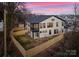 Two story home featuring an enclosed back porch and fenced yard, perfect for outdoor enjoyment and privacy at 2201 Catalina Ave, Charlotte, NC 28206