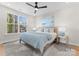 Calm bedroom with a large window, a ceiling fan, and modern decor at 2201 Catalina Ave, Charlotte, NC 28206