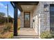 A front door features a glass panel, modern stone work, and updated address numbers at 2201 Catalina Ave, Charlotte, NC 28206