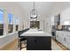 Bright kitchen features a long island, stainless steel appliances, and modern lighting at 2201 Catalina Ave, Charlotte, NC 28206