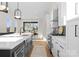 Well-lit kitchen with a large center island, white cabinets, and stainless steel appliances at 2201 Catalina Ave, Charlotte, NC 28206