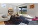 Modern living room with natural light, stylish decor, and sliding glass doors to the backyard at 2201 Catalina Ave, Charlotte, NC 28206