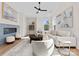 Bright, airy living room featuring a fireplace, ceiling fan, and stylish, comfortable furniture at 2201 Catalina Ave, Charlotte, NC 28206