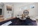 Bright living room with hardwood floors, a unique rug, and a wet bar area at 2201 Catalina Ave, Charlotte, NC 28206