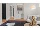 Well-lit living room with a wet bar, wood floors, and an open entryway at 2201 Catalina Ave, Charlotte, NC 28206