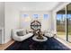 Bright living room with natural light, plush seating, and unique decor at 2201 Catalina Ave, Charlotte, NC 28206