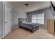 Comfortable bedroom featuring neutral walls, window, and simple furniture for relaxation at 3848 Burnage Hall Rd, Harrisburg, NC 28075