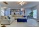 Spacious living room with large sectional sofa and custom built-ins at 3848 Burnage Hall Rd, Harrisburg, NC 28075