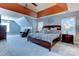 Expansive main bedroom featuring a tray ceiling, sitting area, and abundant natural light at 3848 Burnage Hall Rd, Harrisburg, NC 28075