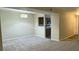 Spacious living room with carpet, neutral walls, and a passthrough to the kitchen at 6017 Treetop Ct, Charlotte, NC 28212