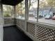 Relaxing screened porch with lattice details and views of the neighborhood at 6017 Treetop Ct, Charlotte, NC 28212