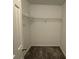 Convenient walk-in closet with wire shelving for clothing and accessories at 6017 Treetop Ct, Charlotte, NC 28212