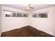 Bedroom with hardwood floors, ceiling fan and window at 6433 Montpelier Rd, Charlotte, NC 28210