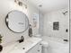 Bathroom featuring a bathtub, sleek fixtures, and modern tile work at 10519 Brawley Ln, Charlotte, NC 28215