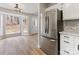 Bright dining area with a refrigerator and adjacent to the kitchen at 10519 Brawley Ln, Charlotte, NC 28215