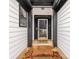 Inviting front porch with brick steps leading to a storm door entrance and adjacent window at 10519 Brawley Ln, Charlotte, NC 28215