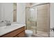 Modern bathroom with tiled walk-in shower, white vanity, and neutral tones at 1074 Kinship Dr # 110, Lancaster, SC 29720