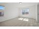 Bright bedroom with two windows and neutral carpet at 1074 Kinship Dr # 110, Lancaster, SC 29720