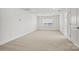Large bonus room features neutral carpeting and ample natural light at 1074 Kinship Dr # 110, Lancaster, SC 29720