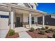 Inviting covered front porch with brick accents, offering a cozy entrance to the home at 1074 Kinship Dr # 110, Lancaster, SC 29720