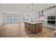 Open-concept kitchen with a large island, stainless steel appliances, and ample counter space at 1074 Kinship Dr # 110, Lancaster, SC 29720
