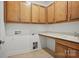 Laundry room featuring tile floor, built-in cabinets, and white countertops at 1074 Kinship Dr # 110, Lancaster, SC 29720