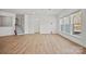 Bright living room with hardwood floors, staircase and large windows at 1074 Kinship Dr # 110, Lancaster, SC 29720