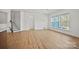 Bright living room with hardwood floors, staircase and large windows at 1074 Kinship Dr # 110, Lancaster, SC 29720