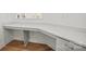 Close up of the office desk area with quartz countertops and hardwood floors at 1074 Kinship Dr # 110, Lancaster, SC 29720