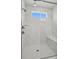 Modern shower has floor-to-ceiling tile, a window, and a glass door at 1074 Kinship Dr # 110, Lancaster, SC 29720