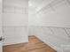 Spacious walk-in closet equipped with wire shelving and LVP flooring at 1074 Kinship Dr # 110, Lancaster, SC 29720
