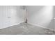 Bedroom featuring plush carpet, double-door closet, and doorway leading to additional rooms at 1133 Hallman Branch Ln, Lincolnton, NC 28092