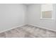 Comfortable bedroom boasts plush carpeting, a bright window, and a soothing neutral color palette at 1133 Hallman Branch Ln, Lincolnton, NC 28092