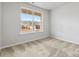 Bright bedroom showcasing a large window offering natural light and neutral carpet flooring at 1133 Hallman Branch Ln, Lincolnton, NC 28092